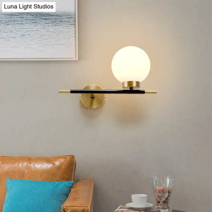 Post-modern white and brass sphere wall sconce bedroom light