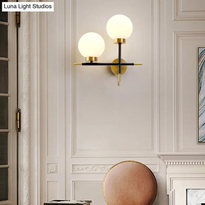 DecorBites™ Post-Modern White Glass Sphere Wall Sconce with Brass Finish - 1/2 Bulbs