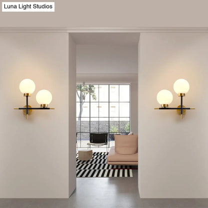 DecorBites™ Post-Modern White Glass Sphere Wall Sconce with Brass Finish - 1/2 Bulbs