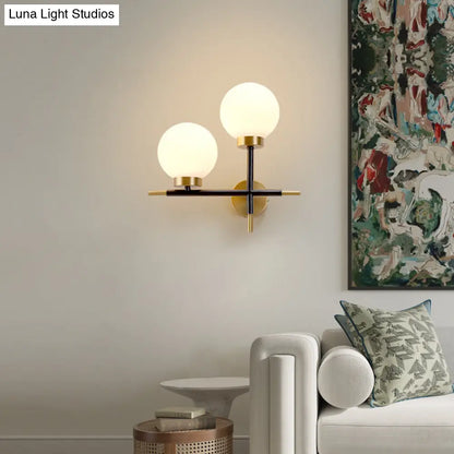 DecorBites™ Post-Modern White Glass Sphere Wall Sconce with Brass Finish - 1/2 Bulbs