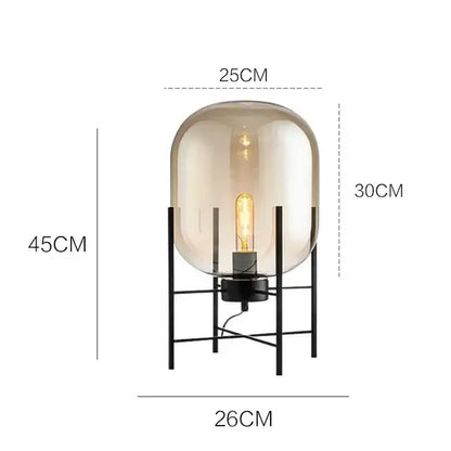 Postmodern amber glass ball floor lamp – living room black metal frame