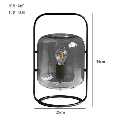 Postmodern amber glass ball floor lamp – living room black metal frame