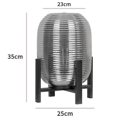 Postmodern amber glass ball floor lamp – living room black metal frame