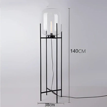 Postmodern amber glass ball floor lamp – living room black metal frame