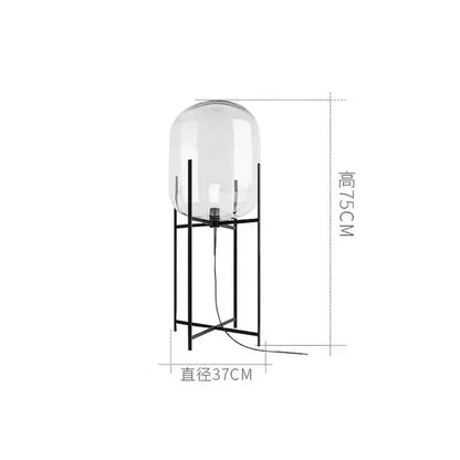 Postmodern amber glass ball floor lamp – living room black metal frame