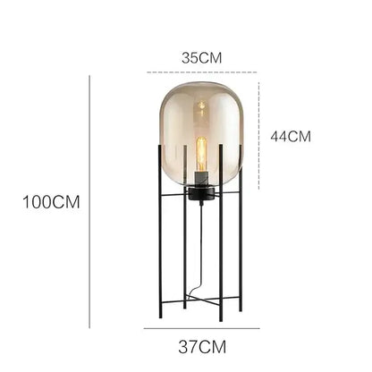 Postmodern amber glass ball floor lamp – living room black metal frame