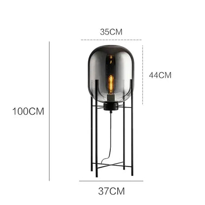 Postmodern amber glass ball floor lamp – living room black metal frame