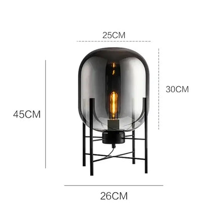 Postmodern amber glass ball floor lamp – living room black metal frame