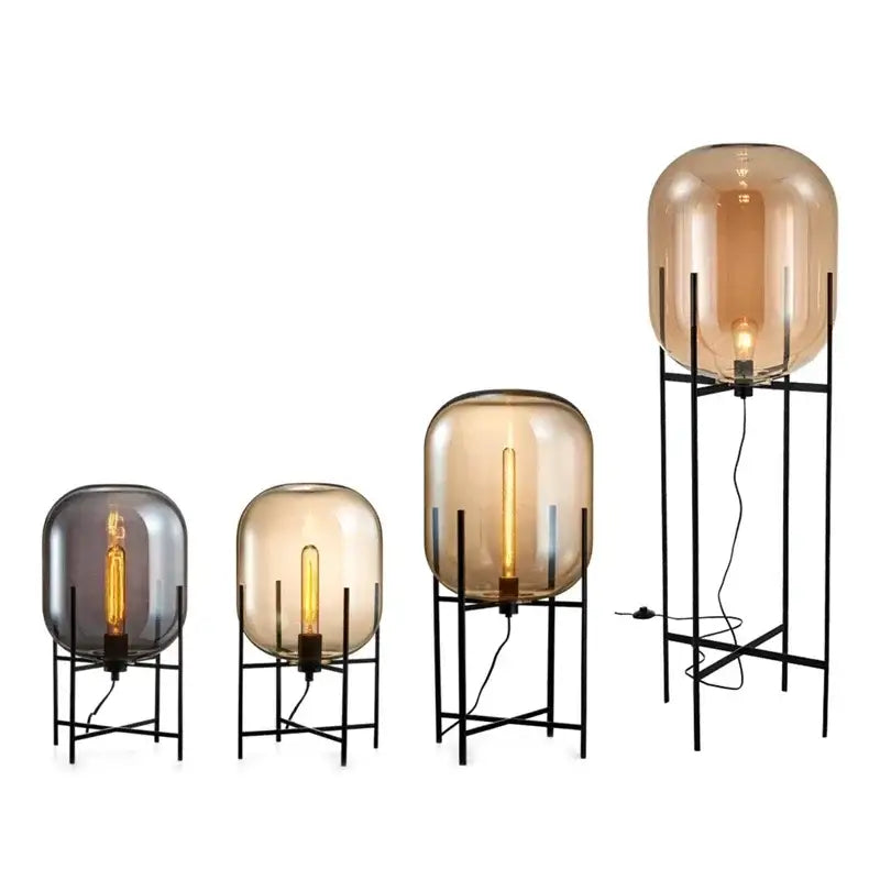 Postmodern amber glass ball floor lamp – living room black metal frame