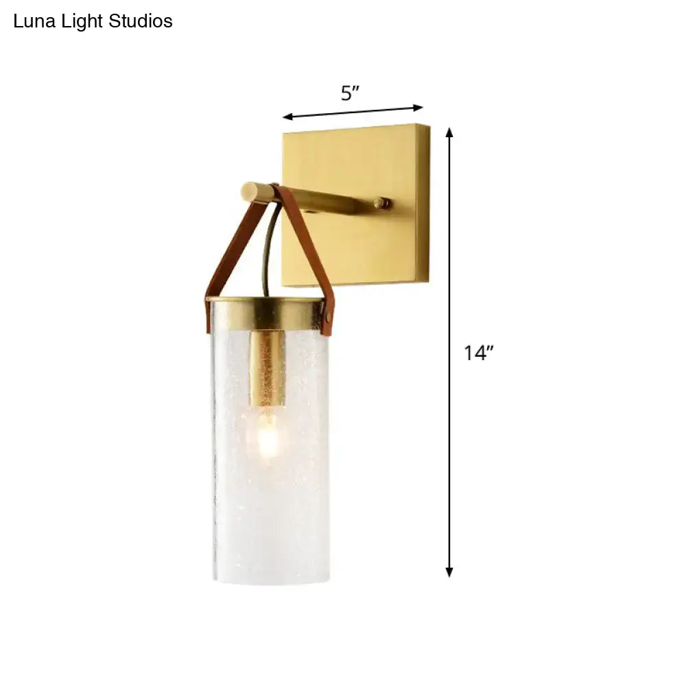 Postmodern brass wall sconce with clear crack glass and leather strap dining room light