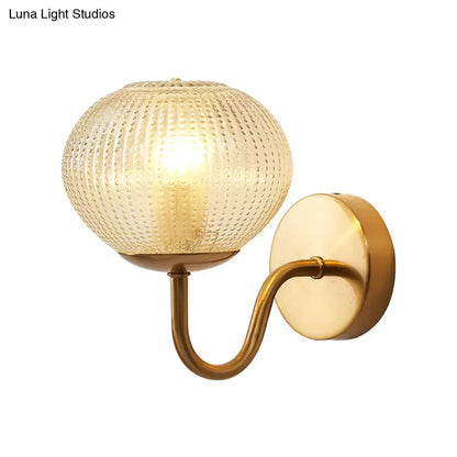 Postmodern gold ball shaped wall sconce with textured glass shade bedroom light