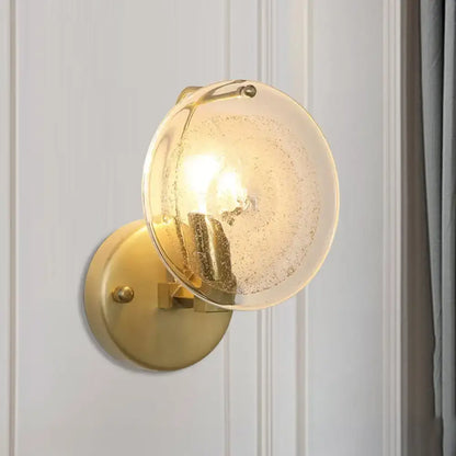 Postmodern gold metal wall sconce with clear glass shade bedroom light