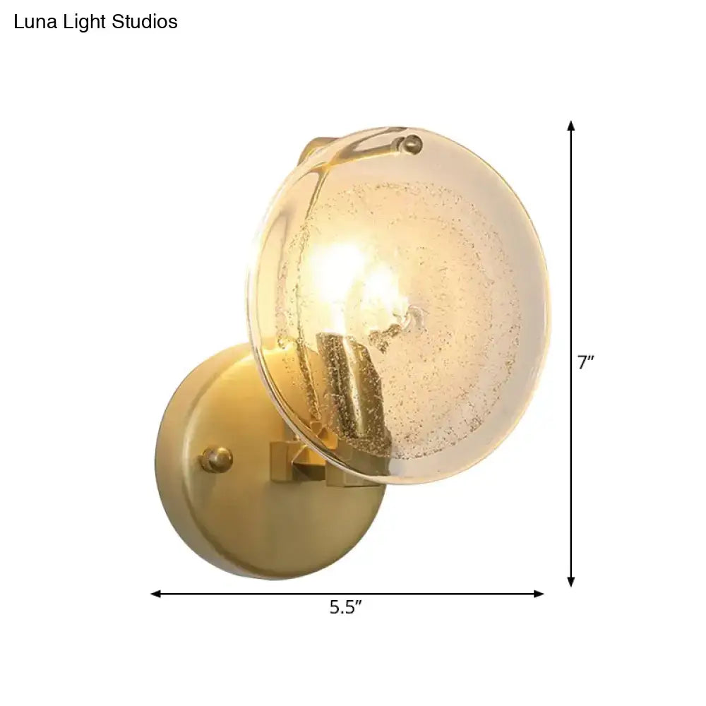 Postmodern gold metal wall sconce with clear glass shade bedroom light
