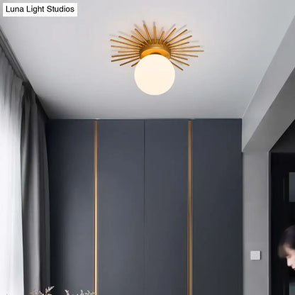 Postmodern gold sunburst ceiling light with cream glass shade bedroom