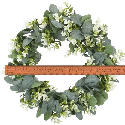 Realistic eucalyptus leaf wreath with white flowers living room decor