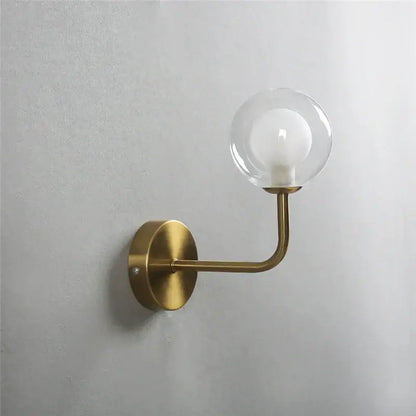 Retro brass curved wall lamp with clear glass ball for bedroom
