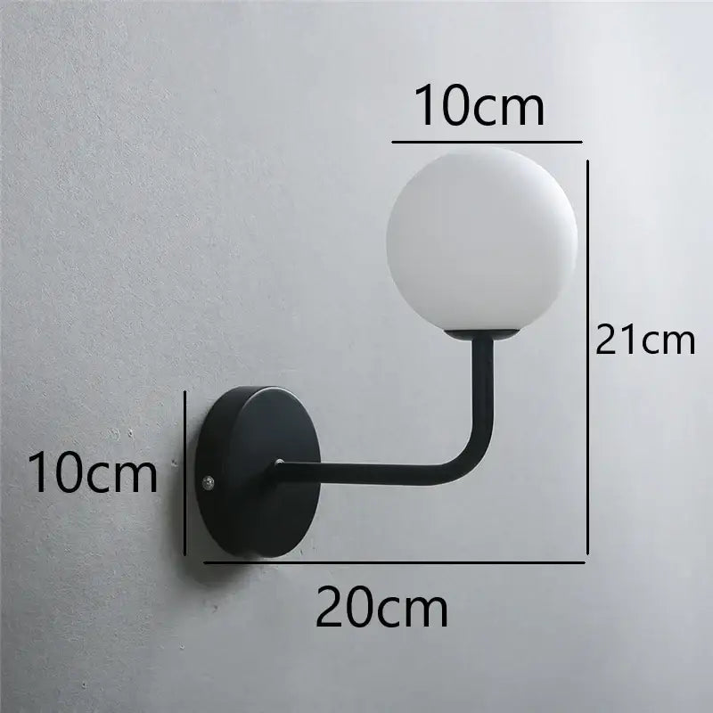 Retro brass curved wall lamp with clear glass ball for bedroom
