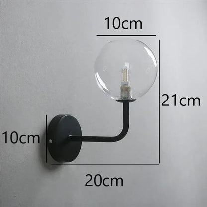 Retro brass curved wall lamp with clear glass ball for bedroom