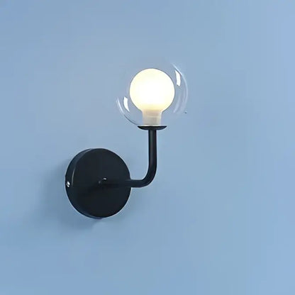 Retro brass curved wall lamp with clear glass ball for bedroom