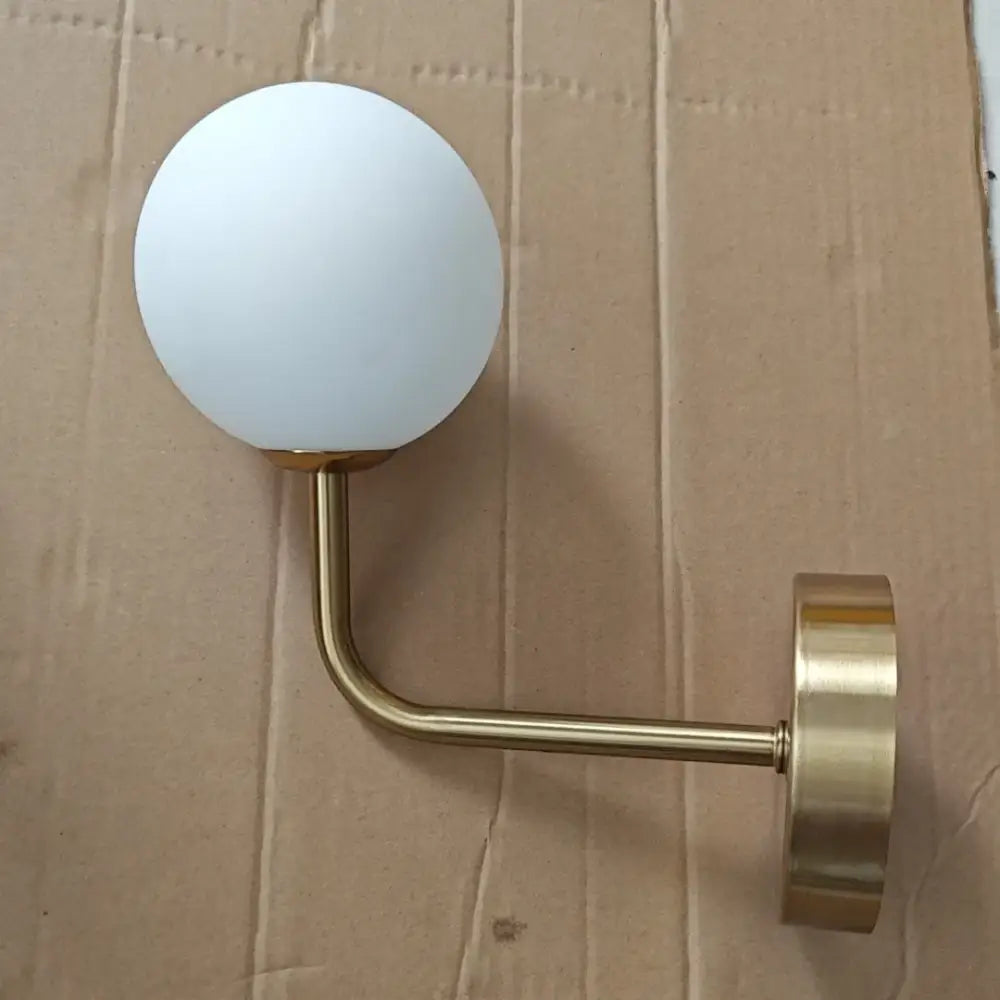 Retro brass curved wall lamp with clear glass ball for bedroom
