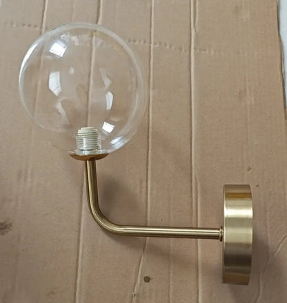 Retro brass curved wall lamp with clear glass ball for bedroom