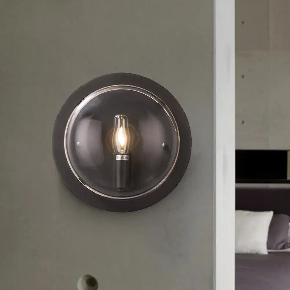 Retro dark gray metal wall sconce with clear glass shade living room