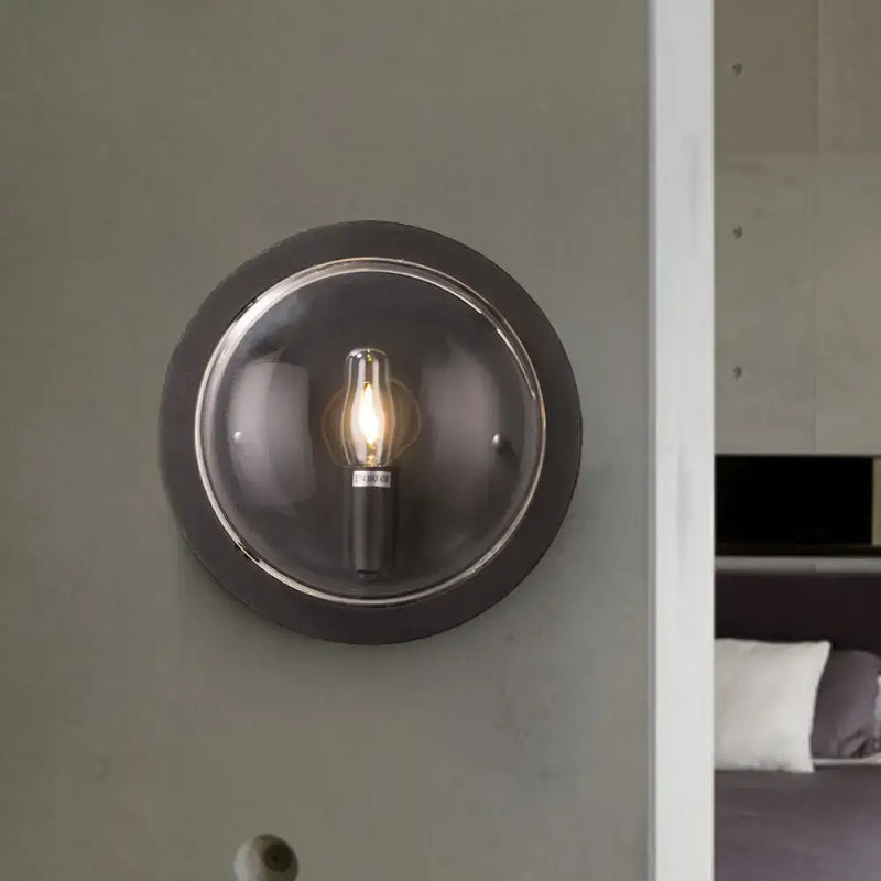 Retro dark gray metal wall sconce with clear glass shade living room