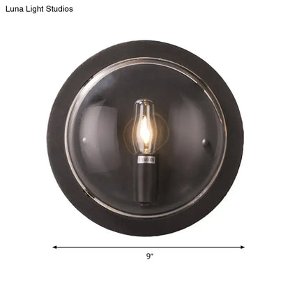 Retro dark gray metal wall sconce with clear glass shade living room