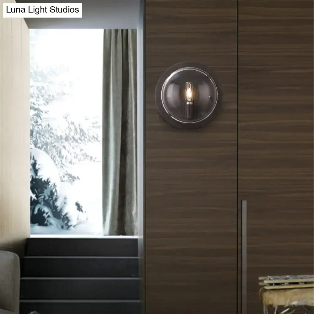 Retro dark gray metal wall sconce with clear glass shade living room