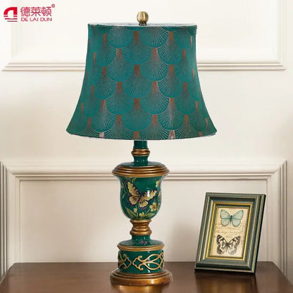 Retro mint green resin table lamp with butterfly detail bedroom light