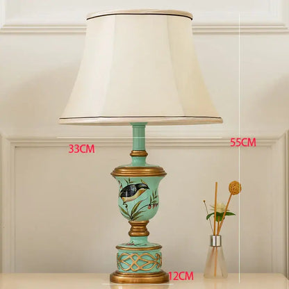 Retro mint green resin table lamp with butterfly detail bedroom light