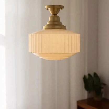 Ribbed cream glass and brass pendant light for dining room