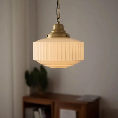 Ribbed cream glass and brass pendant light for dining room