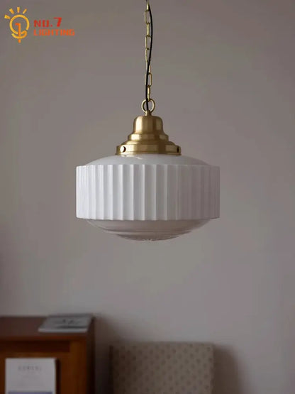 Ribbed cream glass and brass pendant light for dining room