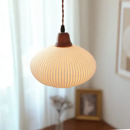 Ribbed cream glass pendant light with wood top for dining room