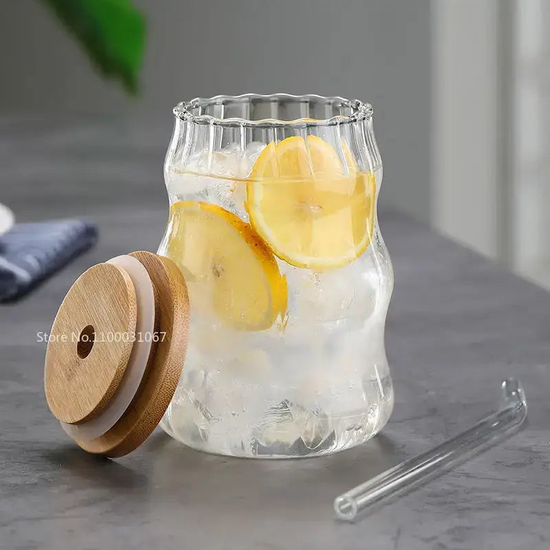 Ribbed glass cup set with bamboo lids and straws for dining room