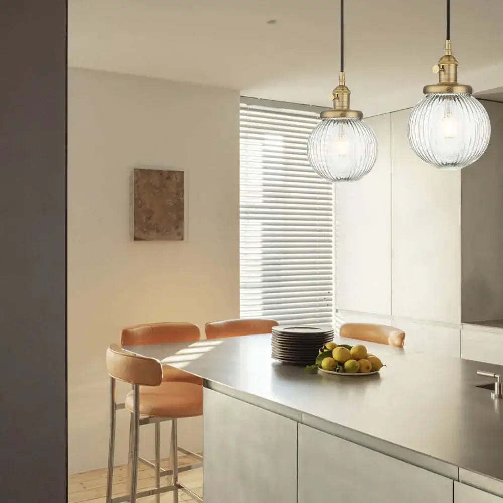 Ribbed glass globe pendant light with brass fixture for living room