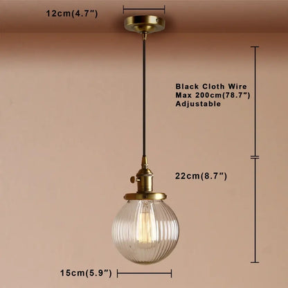 Ribbed glass globe pendant light with brass fixture for living room