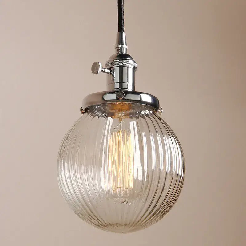 Ribbed glass globe pendant light with brass fixture for living room