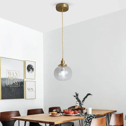 Ribbed green glass pendant light for kitchen island brass hardware
