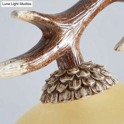 Rustic brown antler ceiling light with flaxen fabric shades bedroom