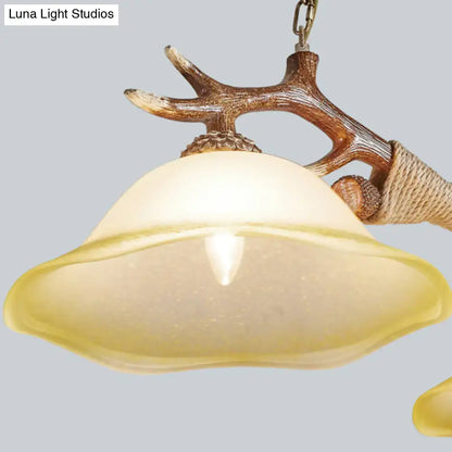 Rustic brown antler ceiling light with flaxen fabric shades bedroom