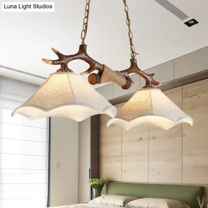 Rustic brown antler ceiling light with flaxen fabric shades bedroom