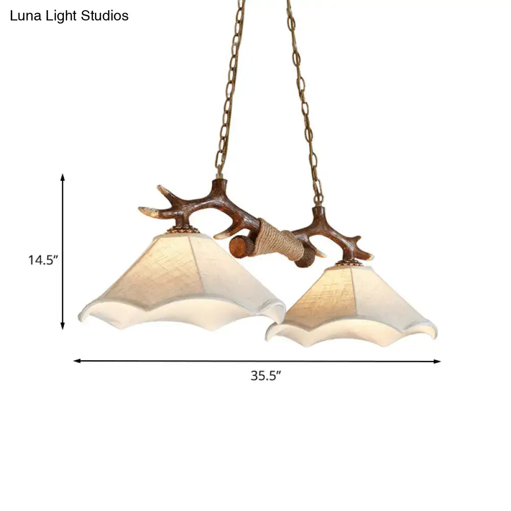 Rustic brown antler ceiling light with flaxen fabric shades bedroom