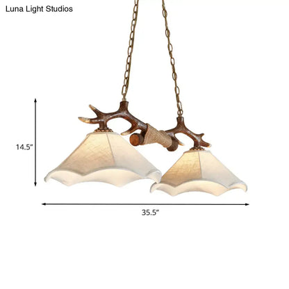 Rustic brown antler ceiling light with flaxen fabric shades bedroom