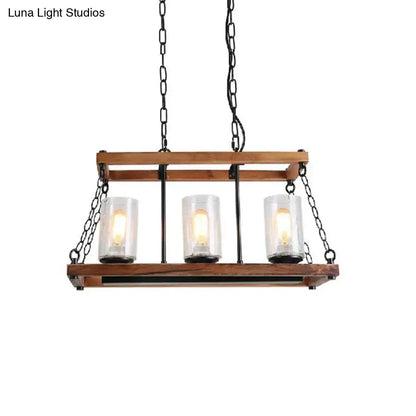 Rustic brown seeded glass island light with wooden trapezoid guard kitchen
