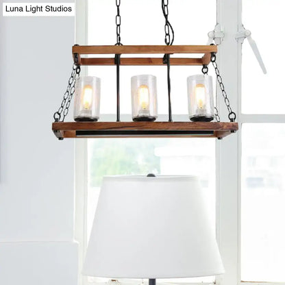 Rustic brown seeded glass island light with wooden trapezoid guard kitchen