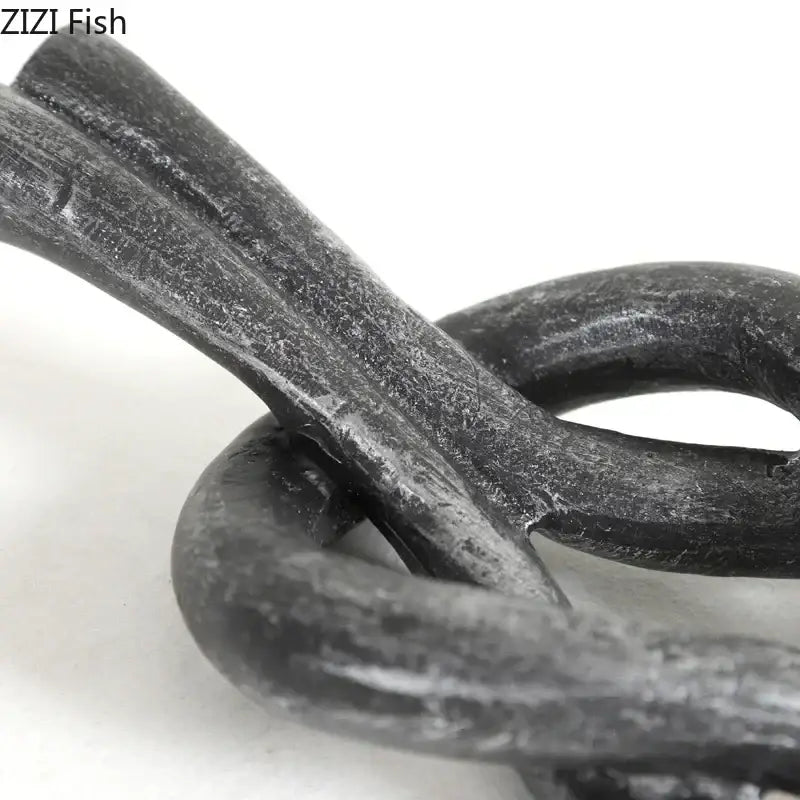 Rustic dark metal geometric knot resin sculpture living room artwork