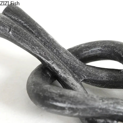 Rustic dark metal geometric knot resin sculpture living room artwork