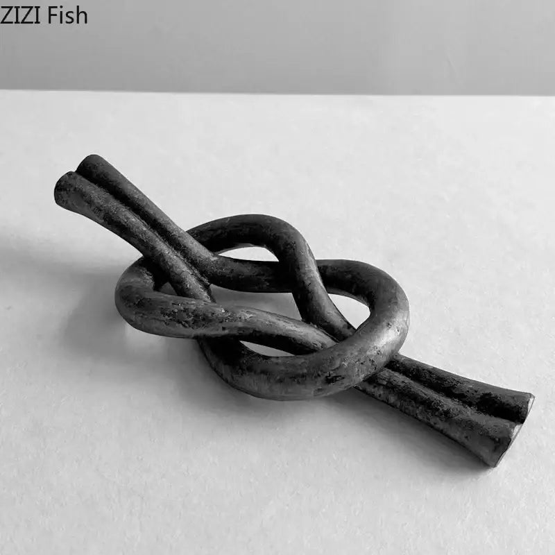 Rustic dark metal geometric knot resin sculpture living room artwork